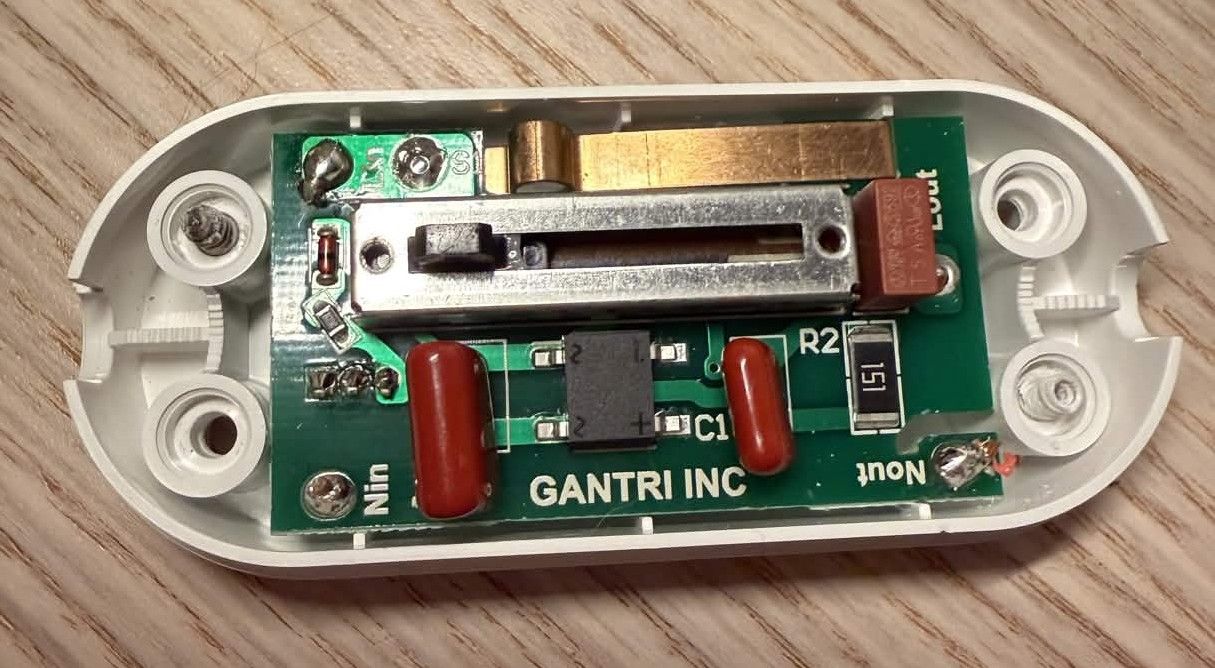 An opened Gantri dimmer switch showing a PCB.