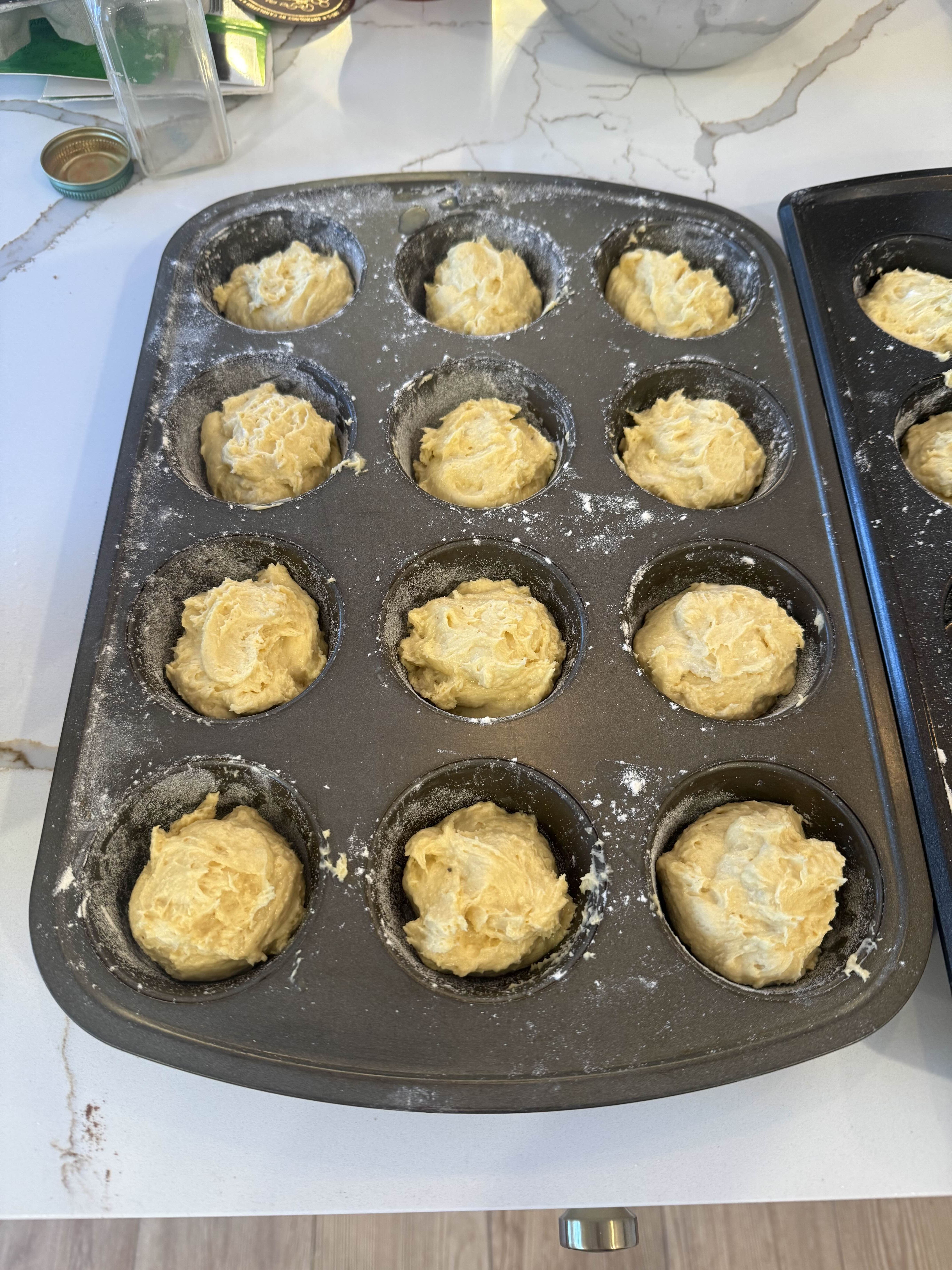 A muffin tin filled with batter